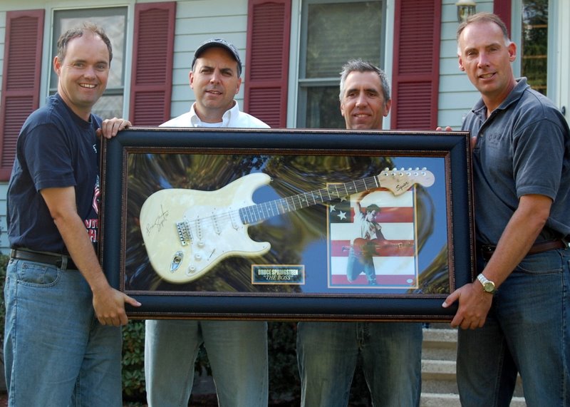 Barry, Pat, John and Martin with a signed guitar, October 2007